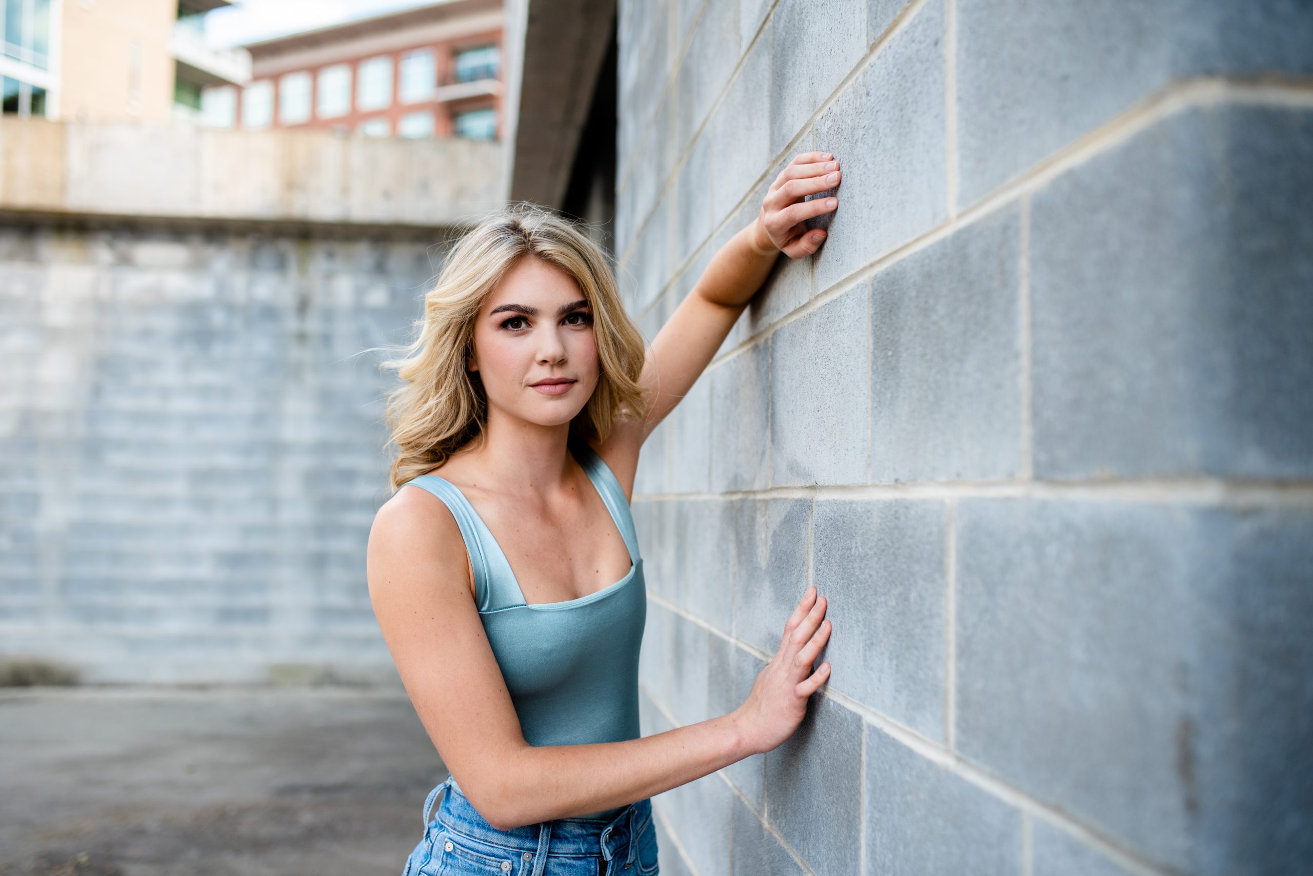 leaning against wall pose for seniors